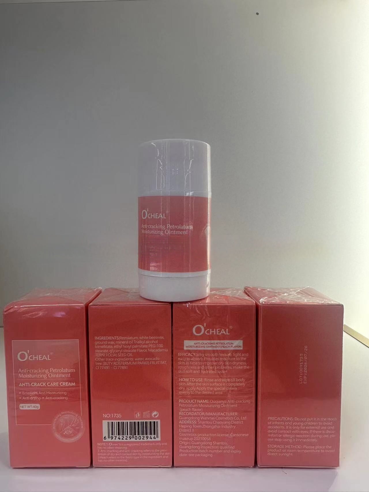 Moisturizing hand and foot cream packaging including a stick and four boxes, O'CHEAL brand.