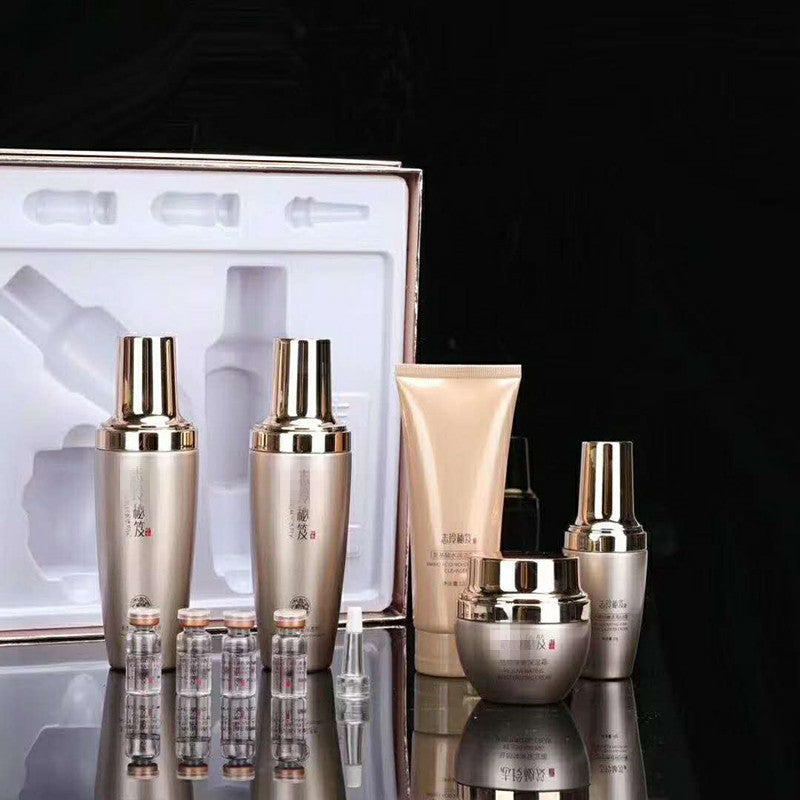 Moisturizing skin care set for ladies displayed in an elegant packaging with various bottles and jars.