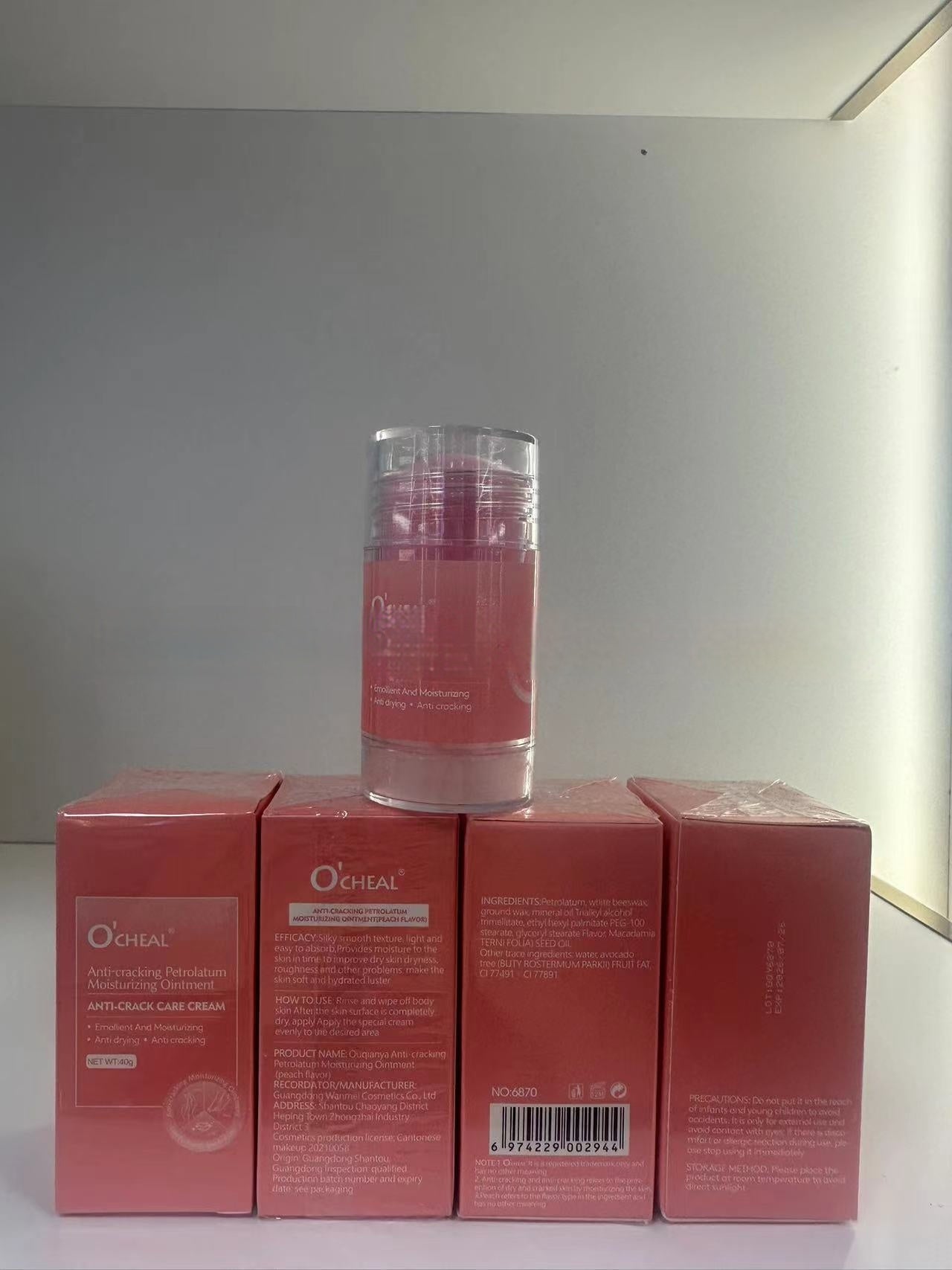 Moisturizing hand and foot cream displayed with packaging boxes, featuring a pink anti-aging care cream.
